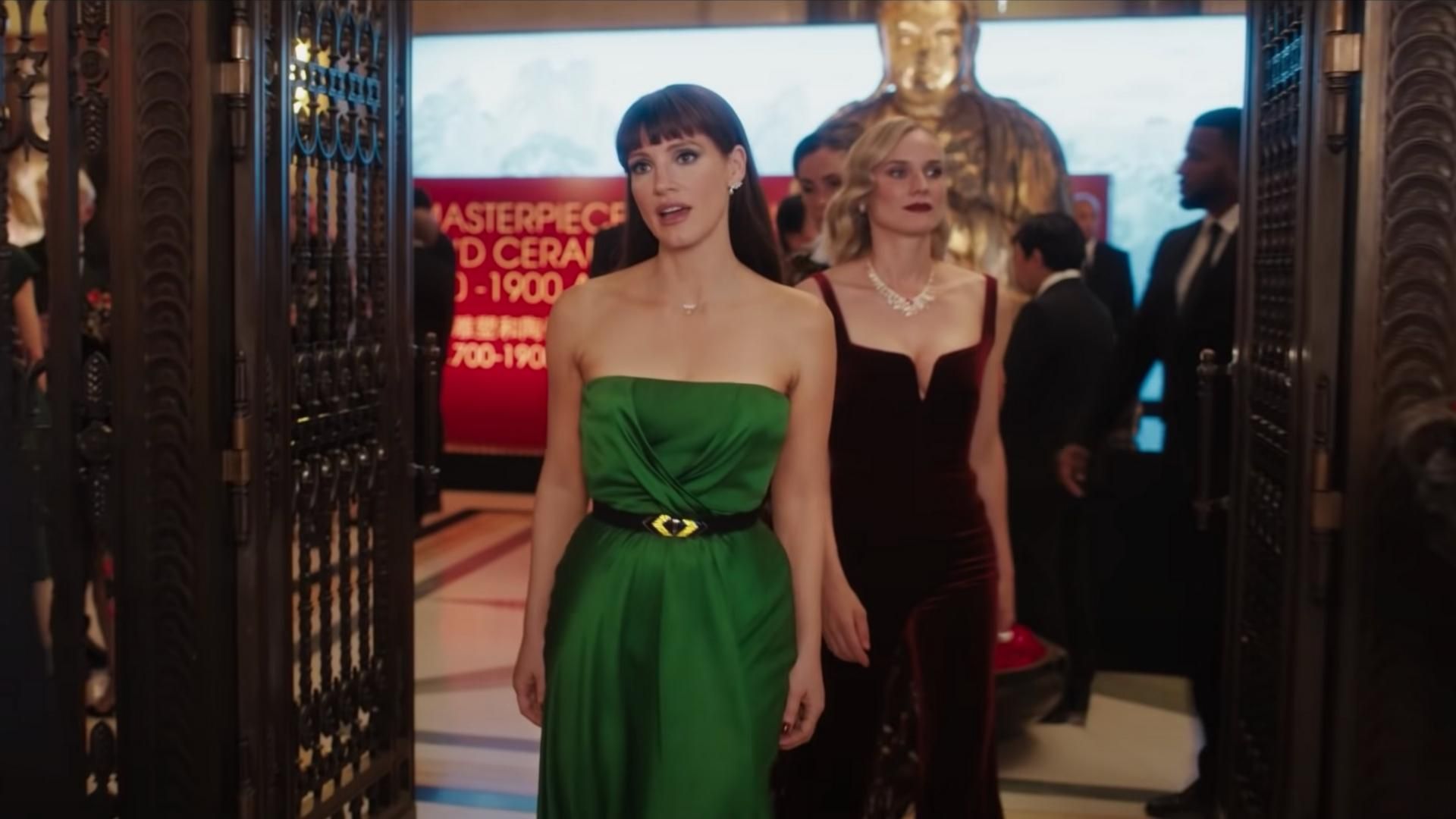 Jessica Chastain wearing green dress in The 355 movie