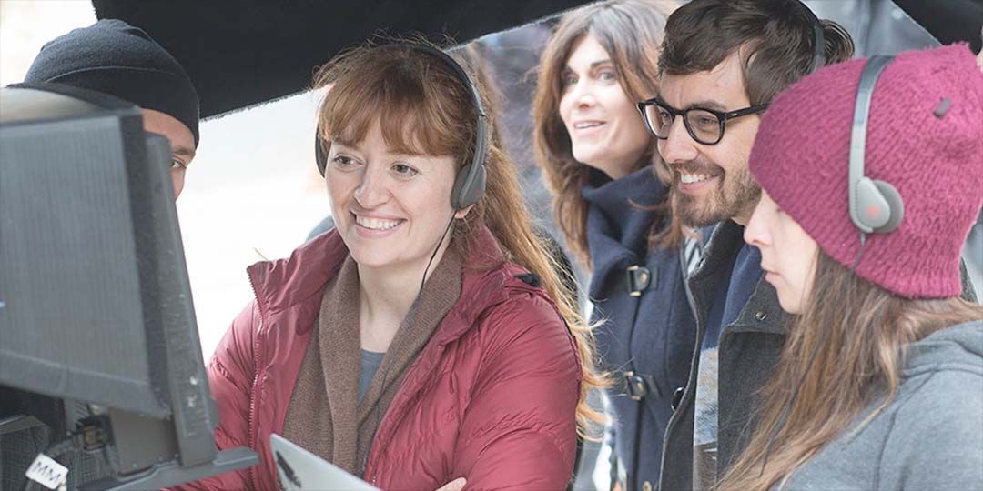 Marielle Heller (center) on the set of 