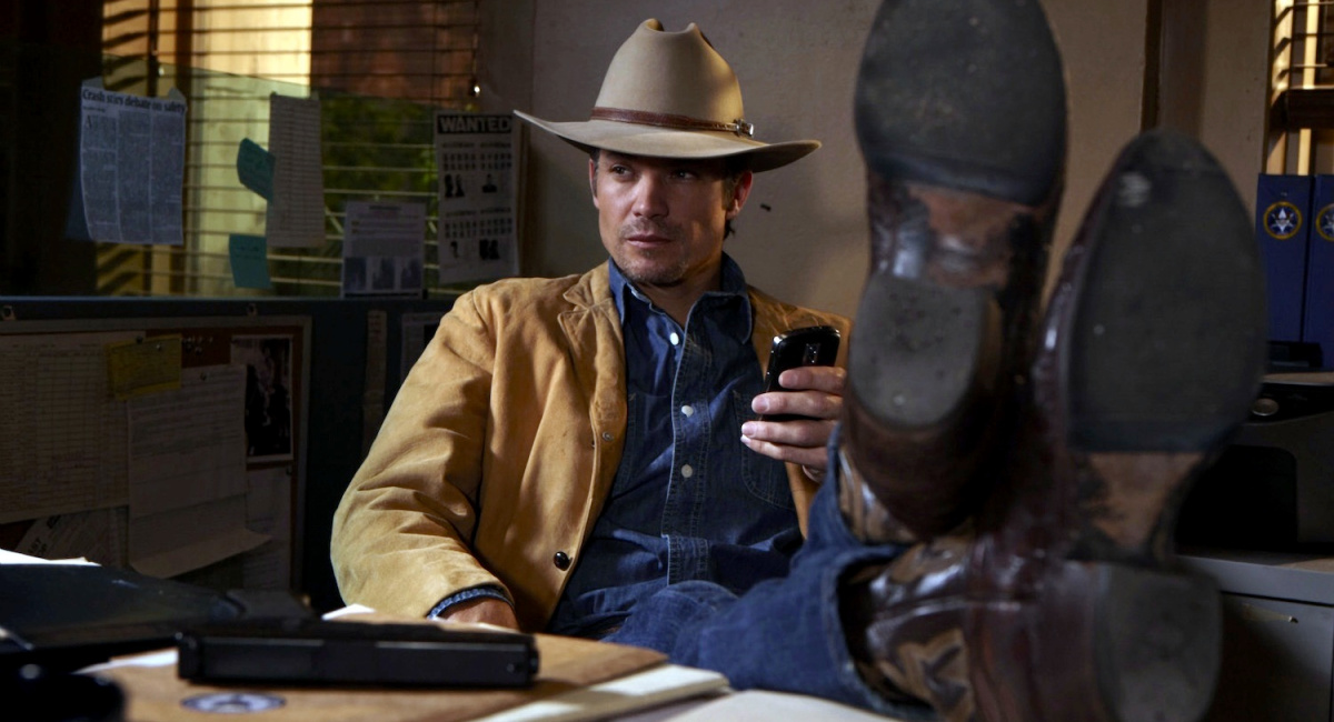 Timothy Olyphant with feet up