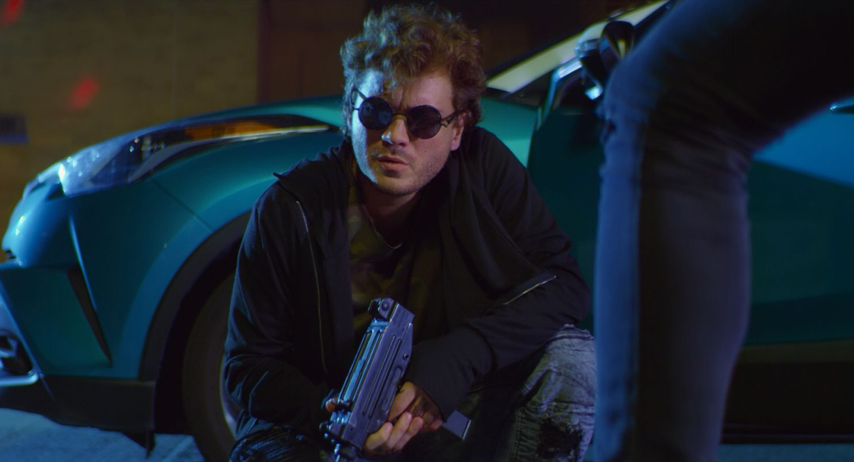 Emile Hirsch with an Uzi