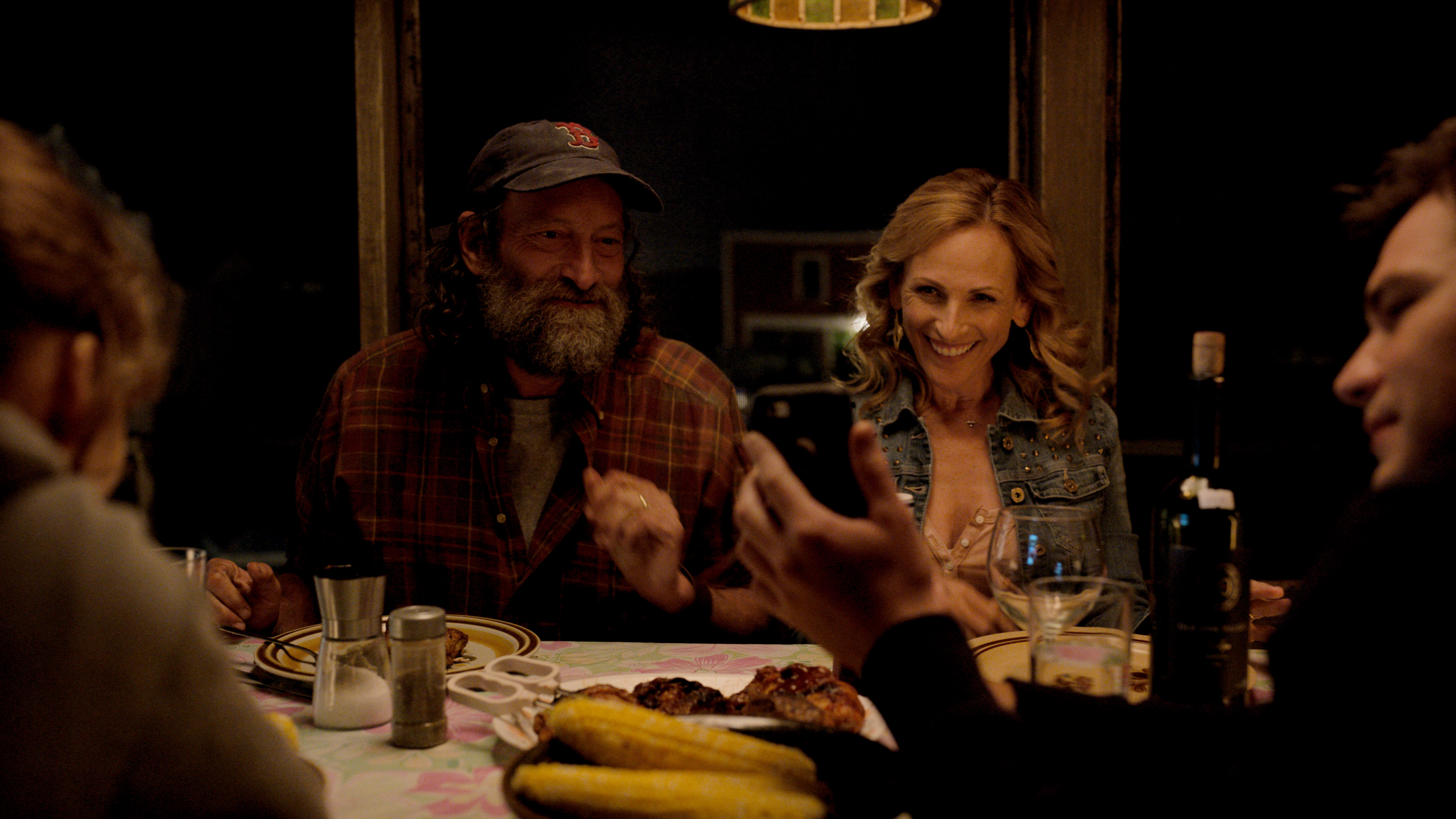 Troy Kotsur and Marlee Matlin at dinner table