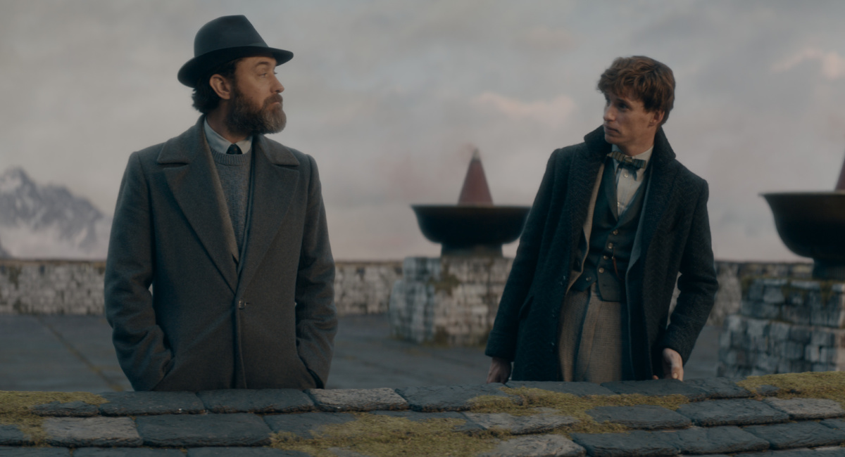 Jude Law as Albus Dumbledore and Eddie Redmayne as Newt Scamander
