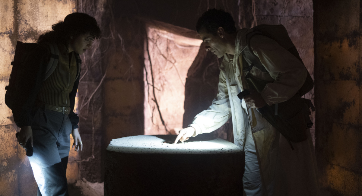 May Calamawy and Oscar Isaac in a tomb