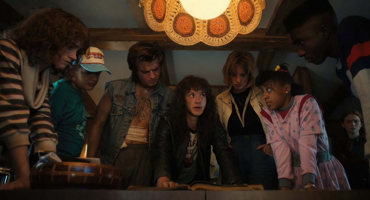 Natalia Dyer as Nancy Wheeler, Gaten Matarazzo as Dustin Henderson, Joe Keery as Steve Harrington, Joseph Quinn as Eddie Munson, Maya Hawke as Robin Buckley, Priah Ferguson as Erica Sinclair, Sadie Sink as Max Mayfield, and Caleb McLaughlin as Lucas Sinclair in 'Stranger Things.'