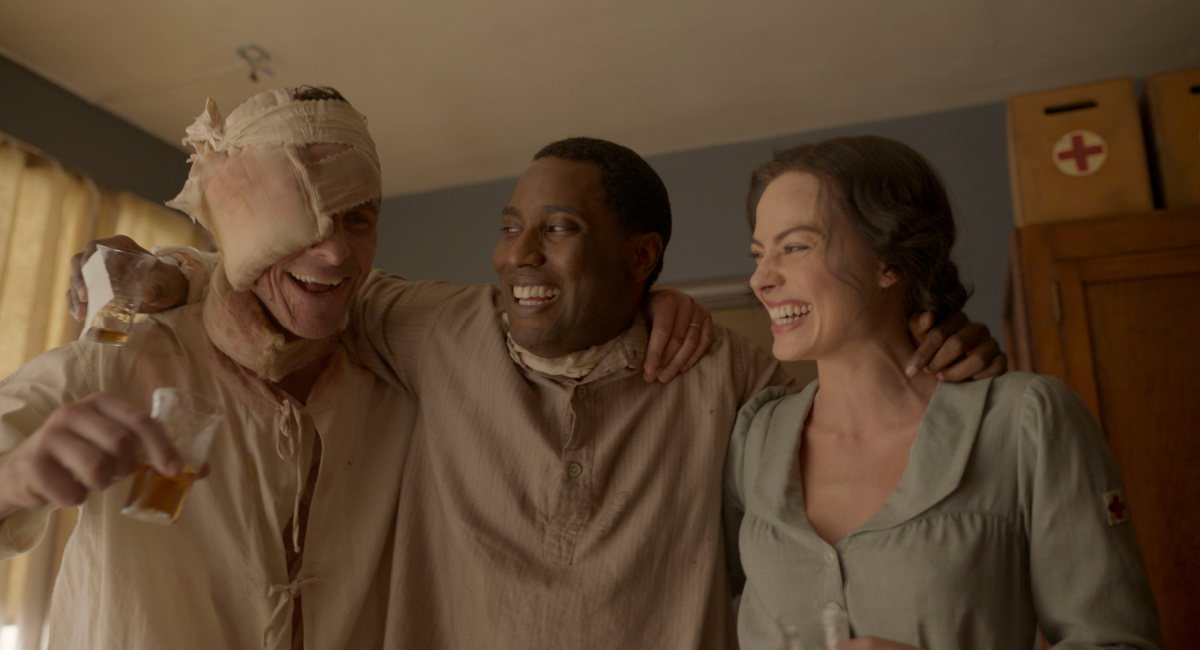 Christian Bale, John David Washington, and Margot Robbie in 20th Century Studios' 'Amsterdam.'