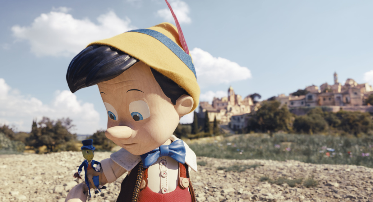 Jiminy Cricket (voiced by Joseph Gordon-Levitt) and Pinocchio (voiced by Benjamin Evan Ainsworth) in Disney's live-action 'Pinocchio,' exclusively on Disney+.
