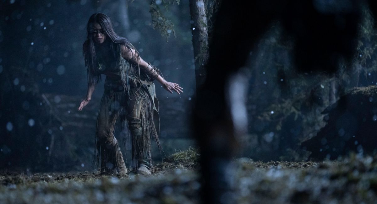 Amber Midthunder as Naru and Dane DiLiegro as the Predator in 20th Century Studios' 'Prey.'