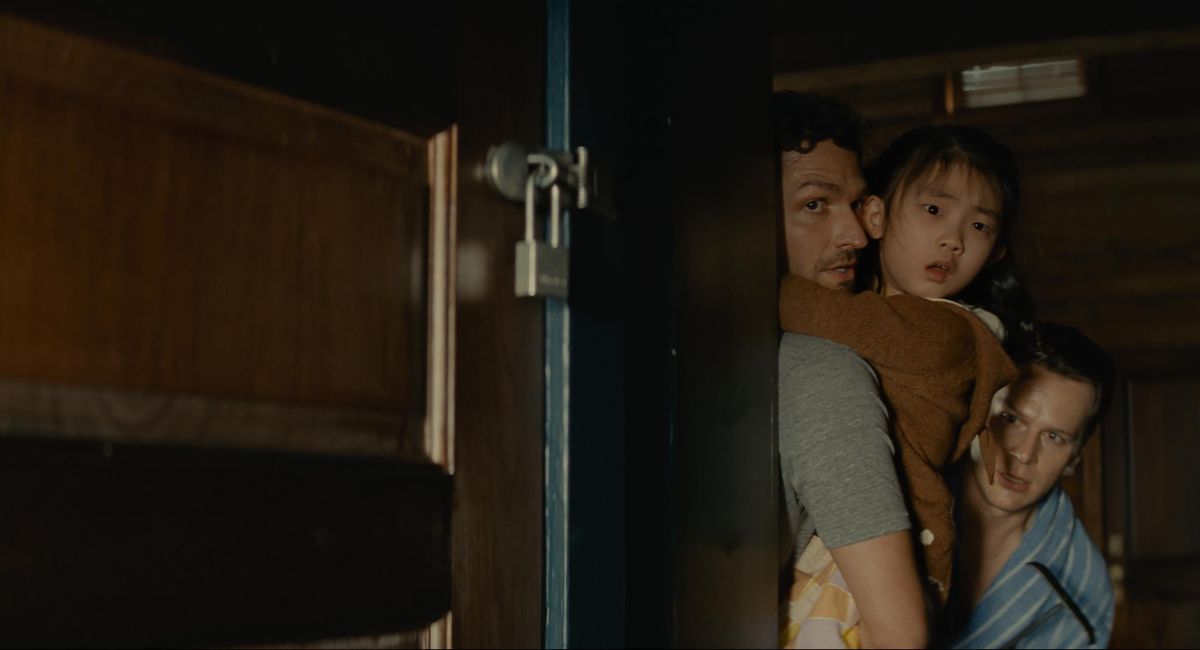 Ben Aldridge, Kristen Cui, and Jonathan Groff in 'Knock at the Cabin,' directed and co-written by M. Night Shyamalan.