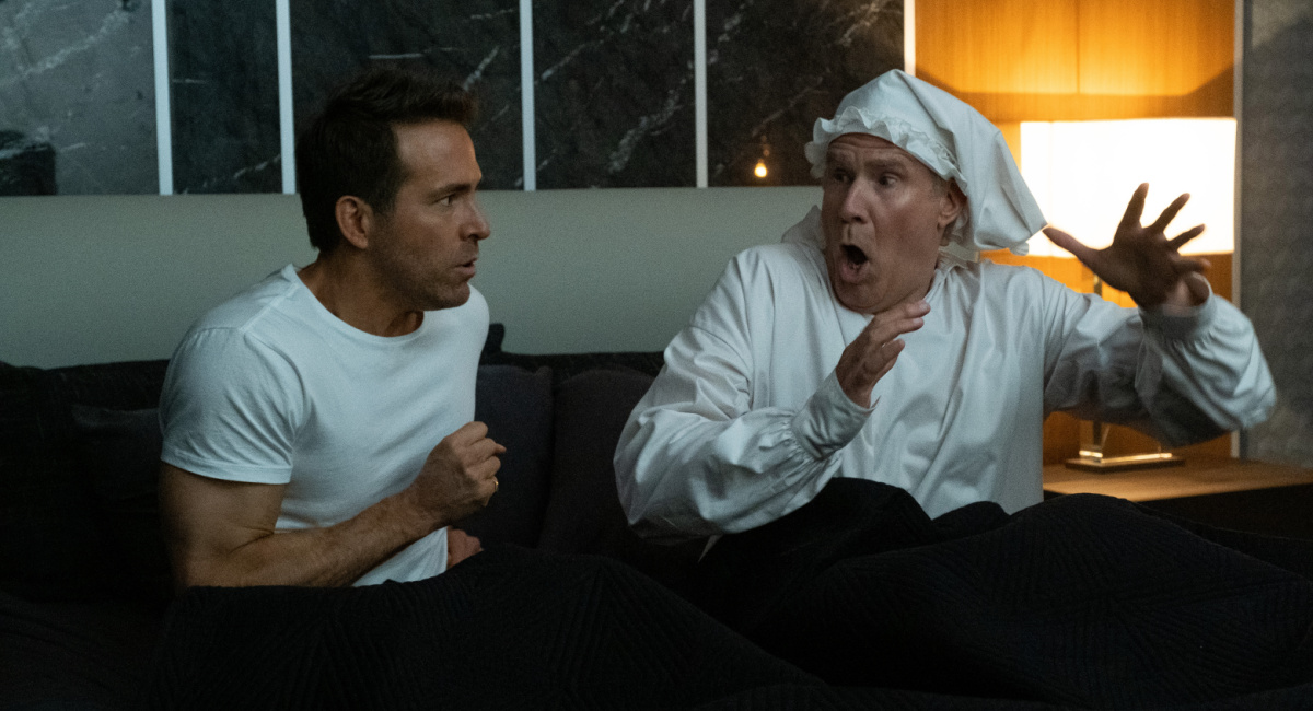 Ryan Reynolds and Will Ferrell in 'Spirited,' premiering November 18, 2022 on Apple TV+.