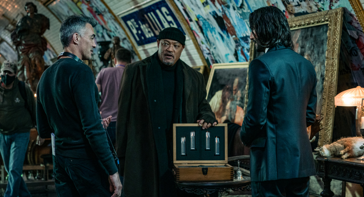 Director Chad Stahelski, Laurence Fishburne as Bowery King, and Keanu Reeves as John Wick in 'John Wick: Chapter 4.'