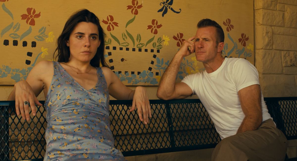 Marianne Rendón as Lola Brisky and Scott Caan as Jackie Powers in the action/thriller, 'One Day as a Lion,' a Lionsgate release.