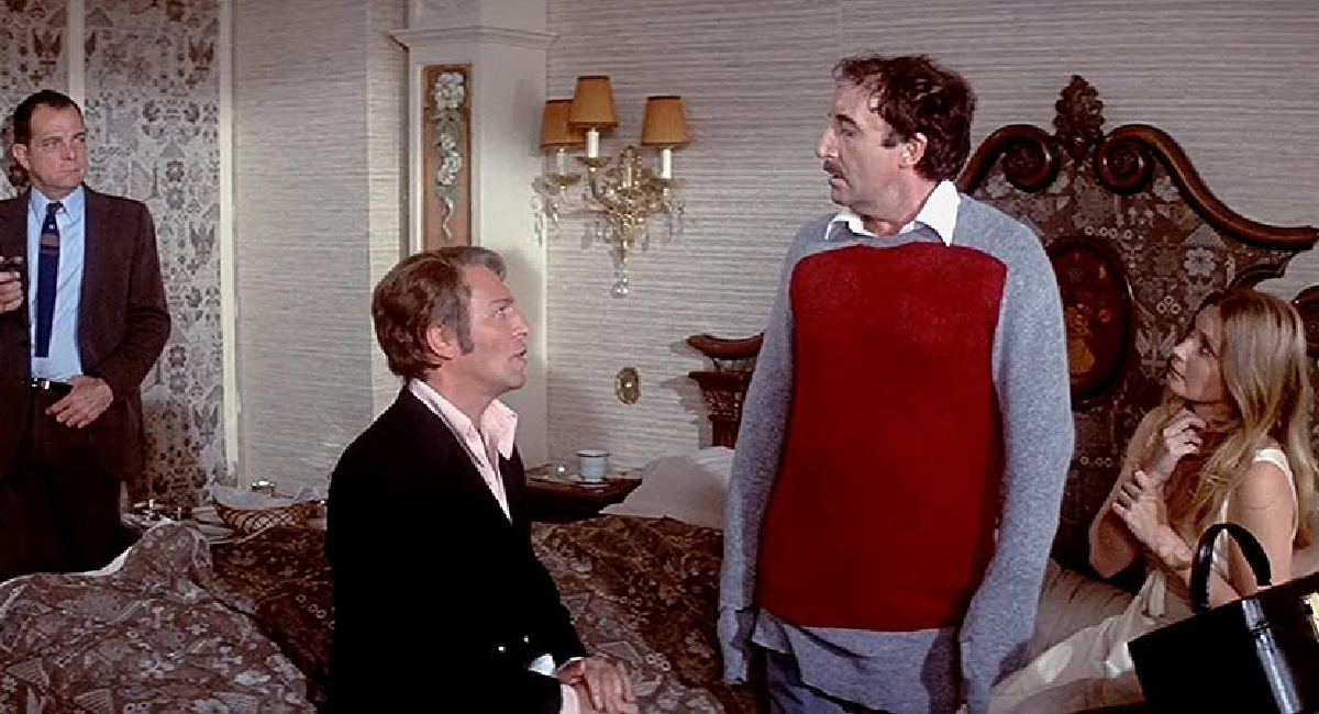 Christopher Plummer as Sir Charles Litton, Peter Sellers as Inspector Jacques Clouseau, and Catherine Schell as Lady Claudine Litton in 'The Return of the Pink Panther.'