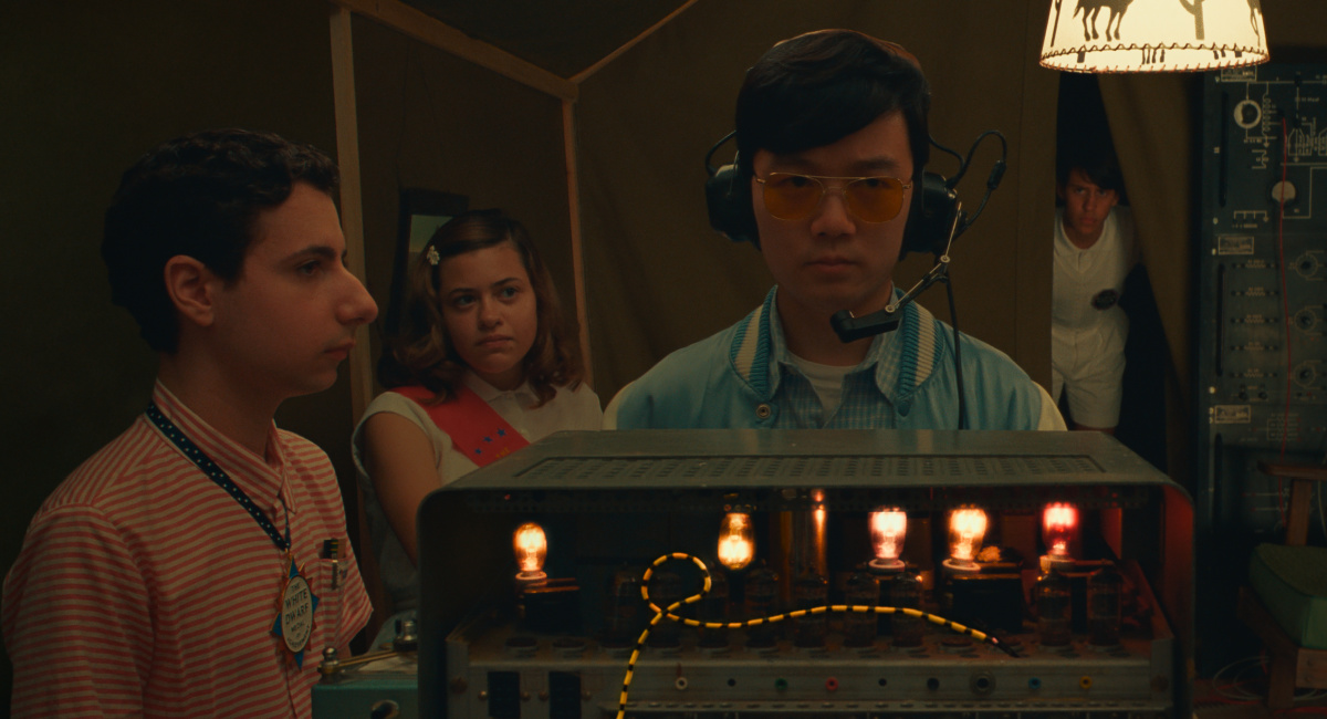 Jake Ryan as "Woodrow", Grace Edwards as "Dinah", Ethan Josh Lee as "Ricky", and Aristou Meehan as "Clifford" in writer/director Wes Anderson's 'Asteroid City,' a Focus Features release.