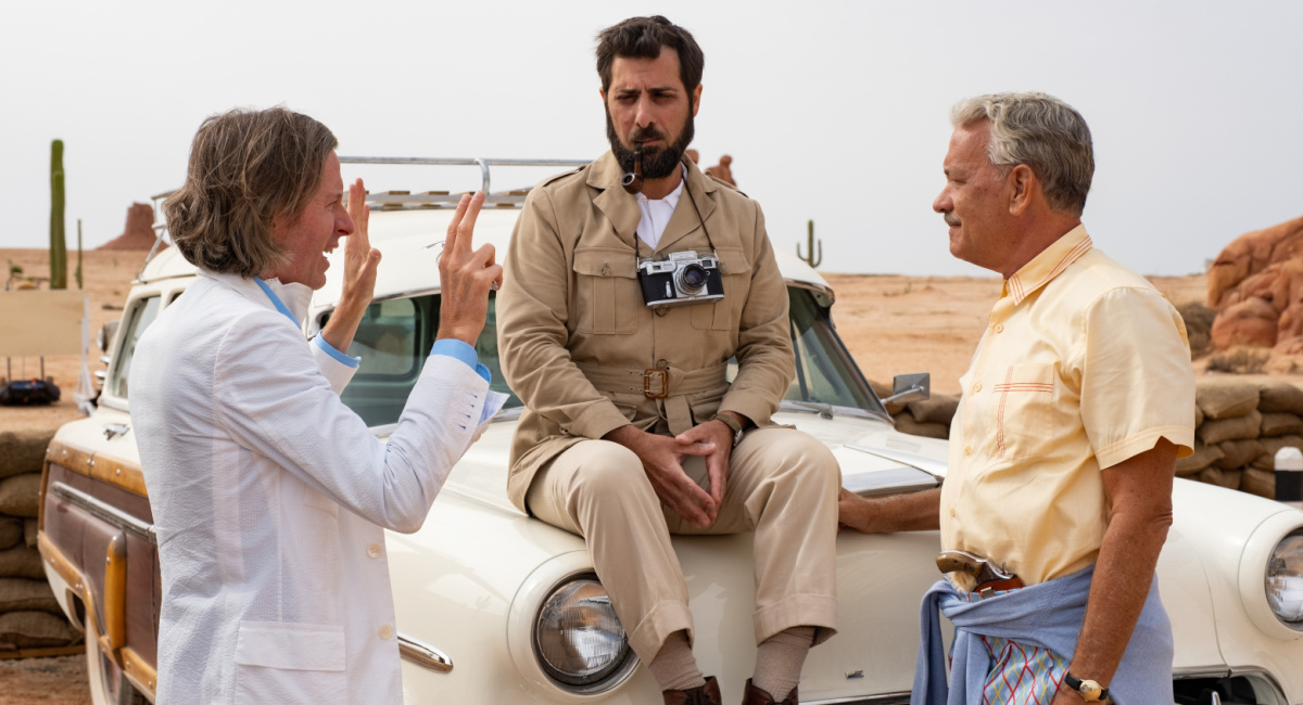 Writer/director Wes Anderson, actor Jason Schwartzman and actor Tom Hanks on the set of 'Asteroid City,' a Focus Features release.