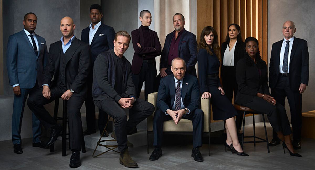 Daniel Breaker as Roger “Scooter” Dunbar, Corey Stoll as Mike Prince, Toney Goins as Philip Charyn, Damian Lewis as Bobby "Axe" Axelrod, Asia Kate Dillon as Taylor Mason, David Costabile as Mike ‘Wags’ Wagner, Paul Giamatti as Chuck Rhoades, Maggie Siff as Wendy Rhoades, Sakina Jaffrey as Daevisha ‘Dave’ Mahar, Dola Rashad as Kate Sacker and Jeffrey DeMunn as Chuck Rhoades, Sr. in 'Billions' Season 7.