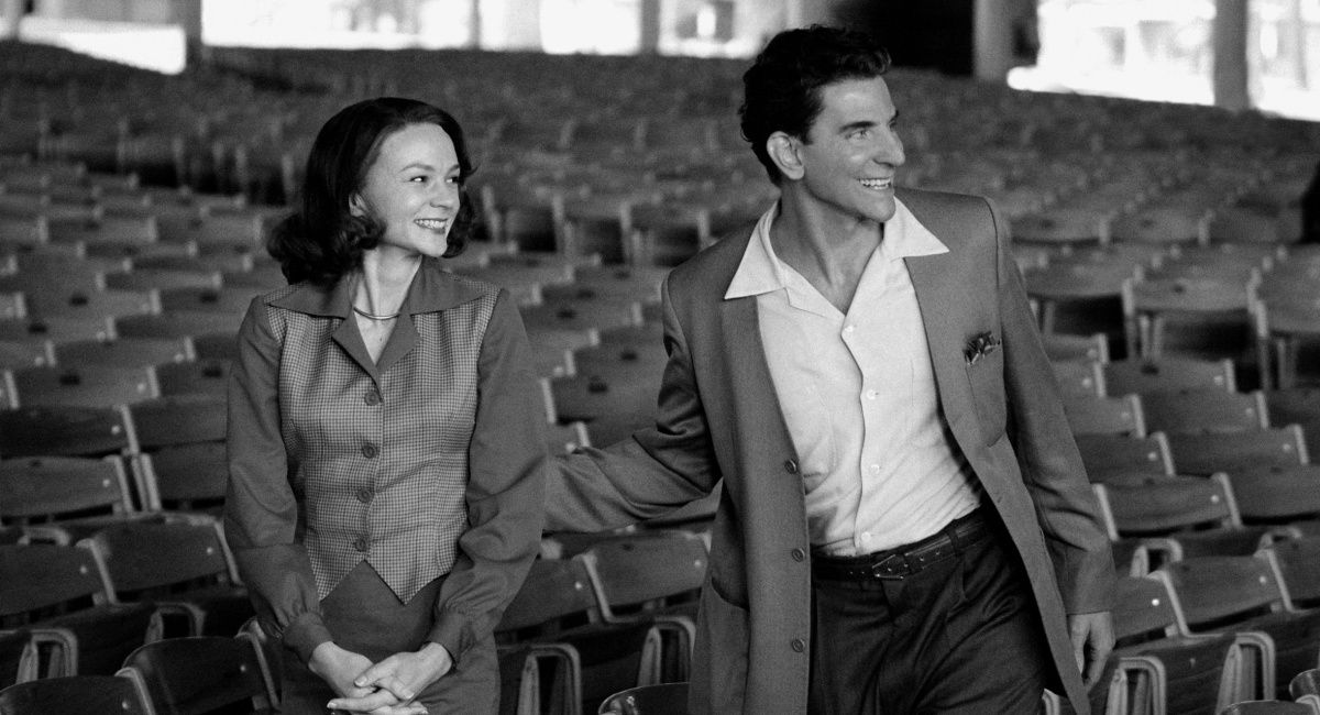 Carey Mulligan as Felicia Montealegre and Bradley Cooper (Director/Writer) as Leonard Bernstein in Maestro.