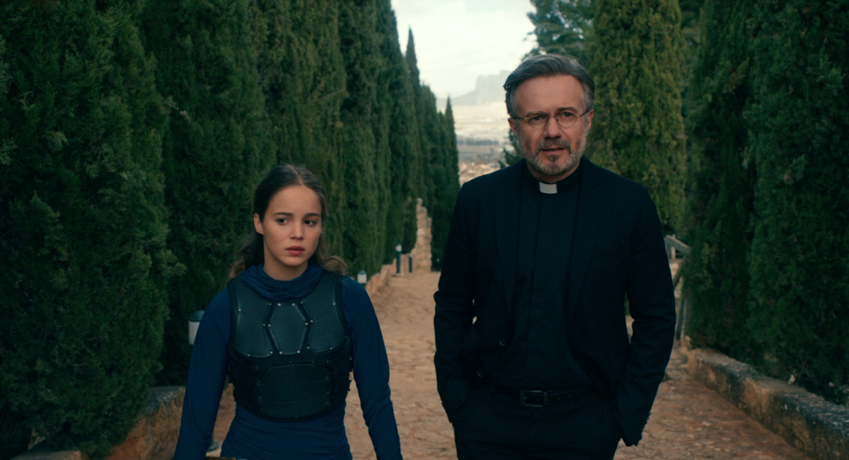 Alba Baptista as Ava, Tristan Ulloa as Father Vincent in 'Warrior Nun.'