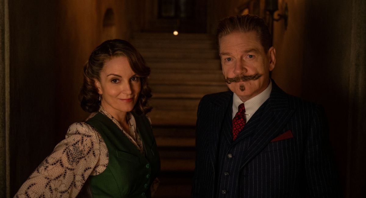 Tina Fey as Ariadne Oliver and Kenneth Branagh as Hercule Poirot in 20th Century Studios' 'A Haunting In Venice.'