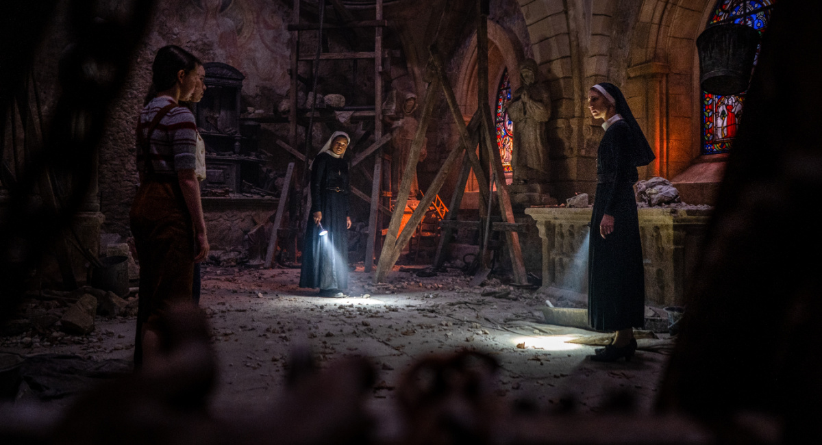Katelyn Rose Downey as Sophie, Anna Popplewell as Kate, Storm Reid as Sister Debra and Taissa Farmiga as Sister Irene in New Line Cinema's horror thriller 'The Nun II,' a Warner Bros. Pictures release.