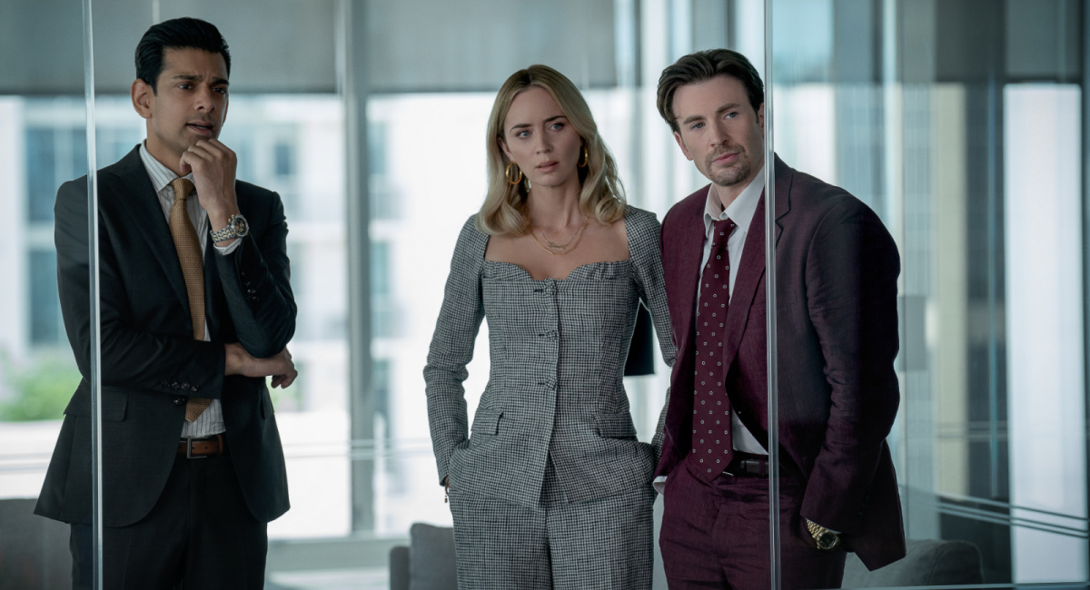Amit Shah as Paley, Emily Blunt as Liza and Chris Evans as Brenner in 'Pain Hustlers.'