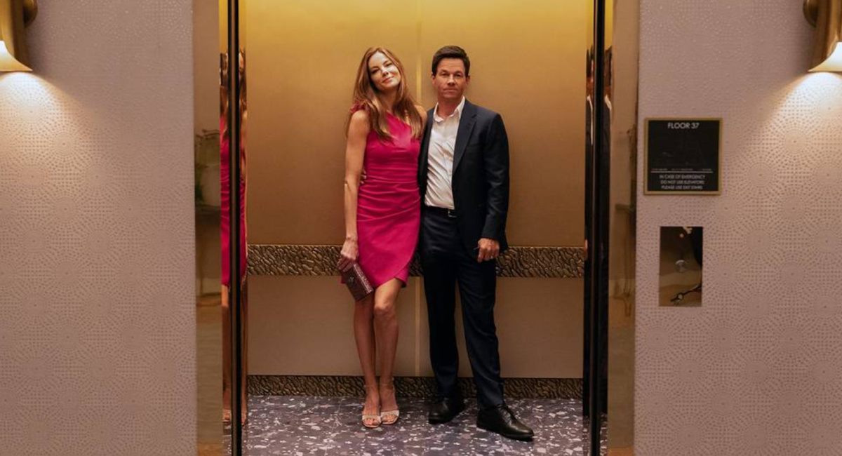 Michelle Monaghan and Mark Wahlberg in 'The Family Plan,' premiering December 15, 2023 on Apple TV+.