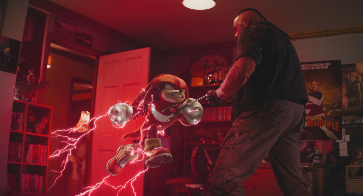 Knuckles (voiced by Idris Elba) and Daniel Singh as Cattleprod Bounty Hunter in 'Knuckles,' streaming on Paramount+, 2024.