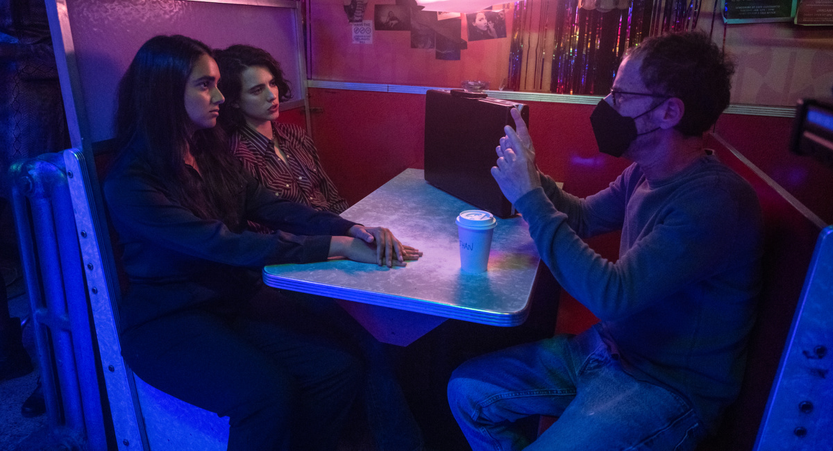 Actor Geraldine Viswanathan, actor Margaret Qualley, and director/writer/producer Ethan Coen on the set of 'Drive-Away Dolls,' a Focus Features release.