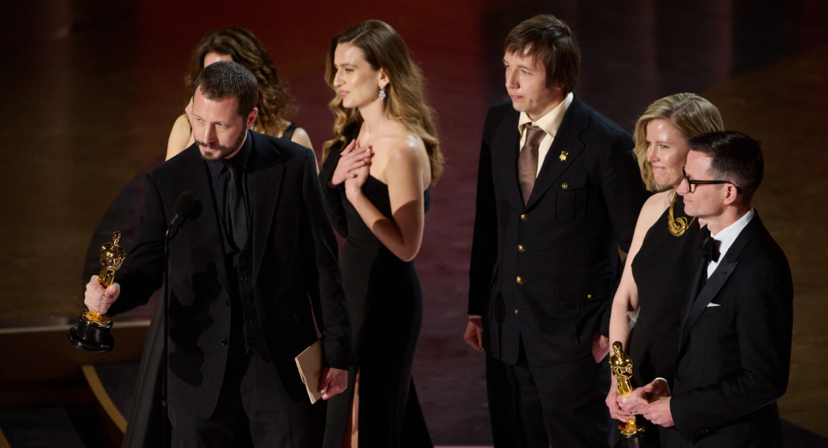 (L to R) Raney Aronson-Rath, Mstyslav Chernov and Michelle Mizner accept the Oscar® for Documentary Feature Film during the live ABC telecast of the 96th Oscars® at the Dolby® Theatre at Ovation Hollywood on Sunday, March 10, 2024. Credit/Provider: Phil McCarten ©A.M.P.A.S. Copyright: ©A.M.P.A.S.