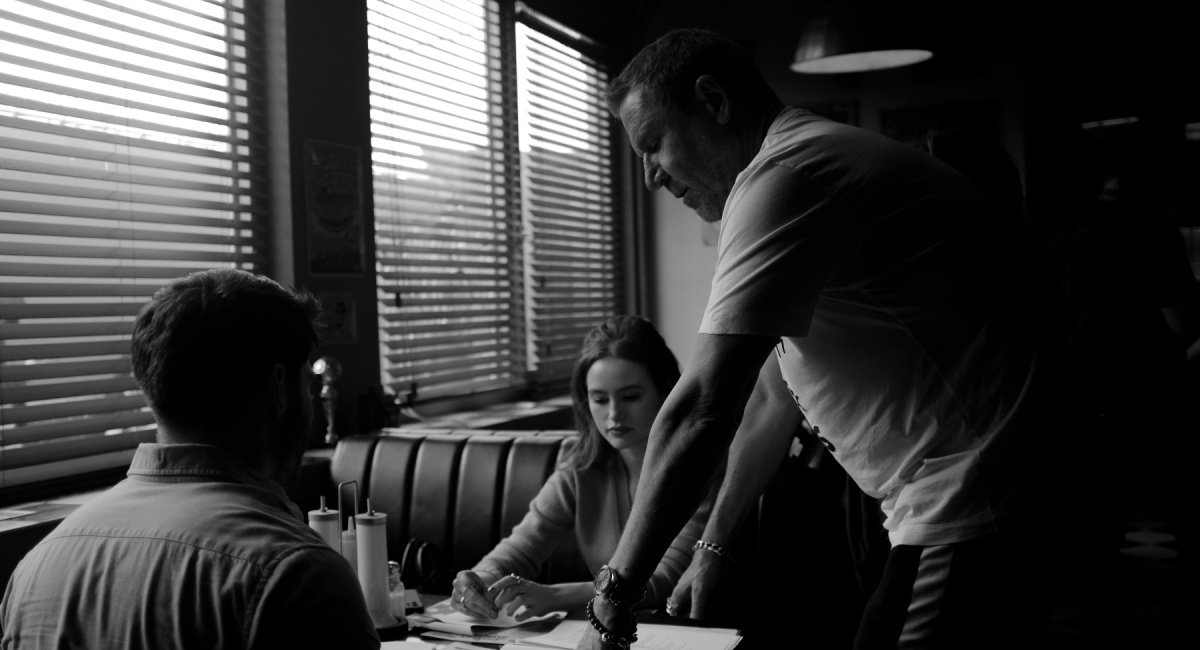 Froy Gutierrez, Madelaine Petsch and director Renny Carlin on the set of 'The Strangers: Chapter 1'.