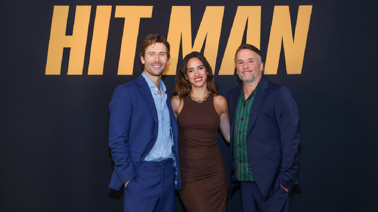 Glen Powell, Adria Arjona, director Richard Linklater and Sanjay Rao for 'Hit Man'.