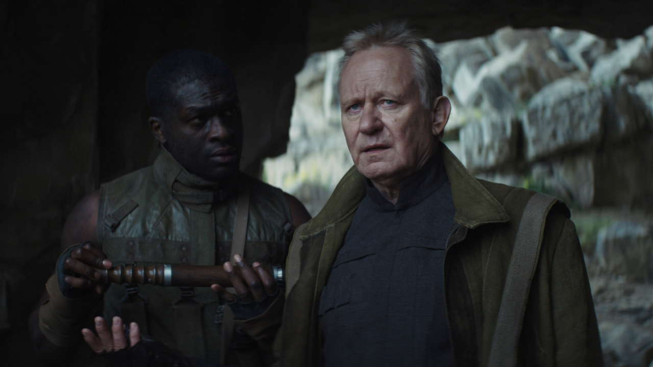 (L to R) Partisan (Leonardo Taiwo) and Luthen Rael (Stellan Skarsgard) in Lucasfilm's 'Andor', exclusively on Disney+. ©2022 Lucasfilm Ltd. & TM. All Rights Reserved.