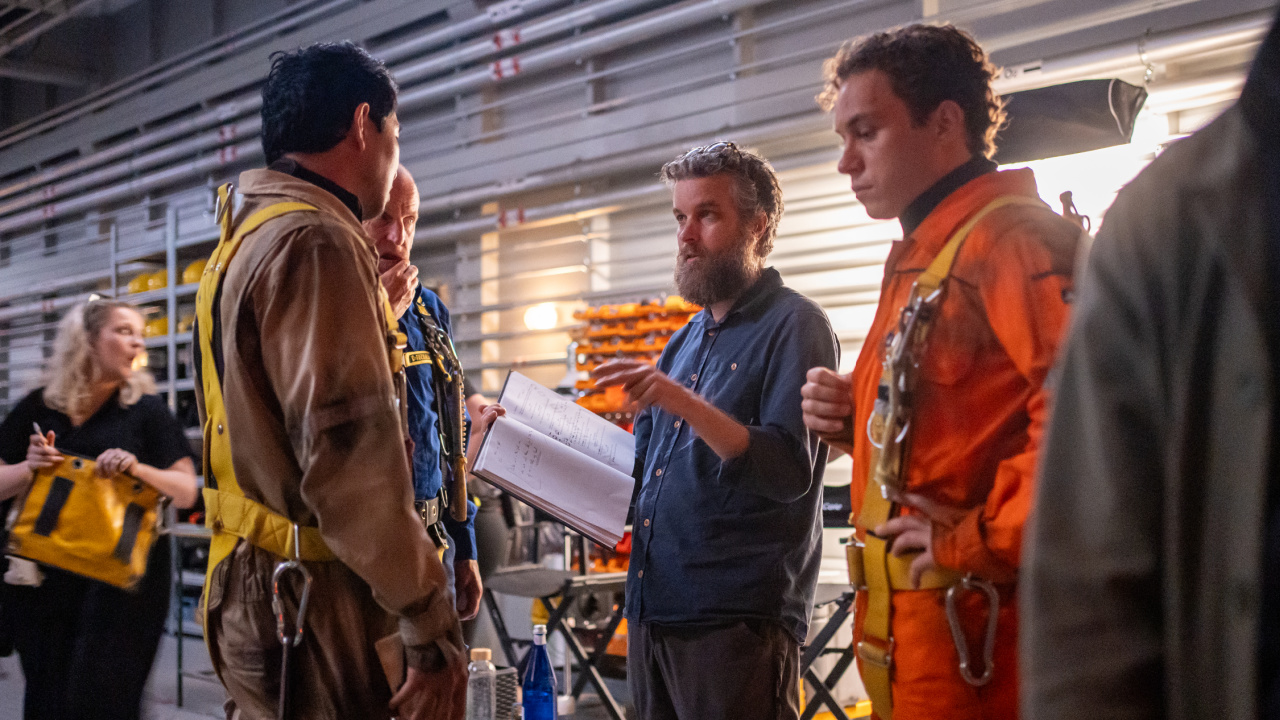 (L to R) Actors Simu Liu, Woody Harrelson and Finn Cole with director Alex Parkinson on the set of their film 'Last Breath', a Focus Features release. Photo: Mark Cassar / © 2024 Focus Features LLC.