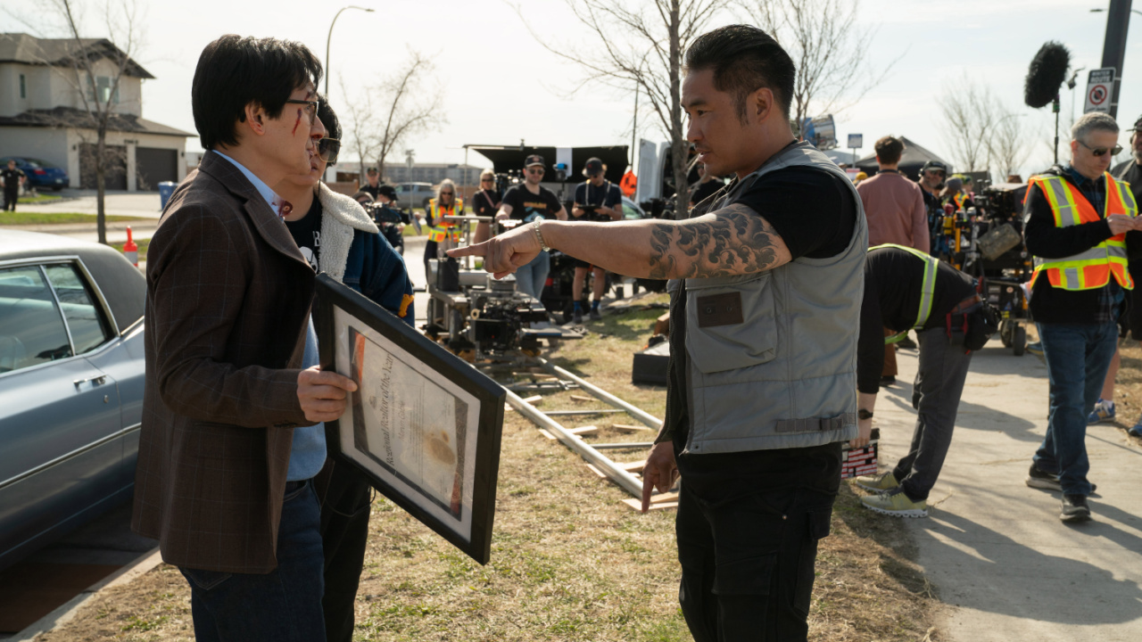 (L to R) Ke Huy Quan and director Jonathan Eusebio on the set of Love Hurts'. Photo: Universal Pictures.