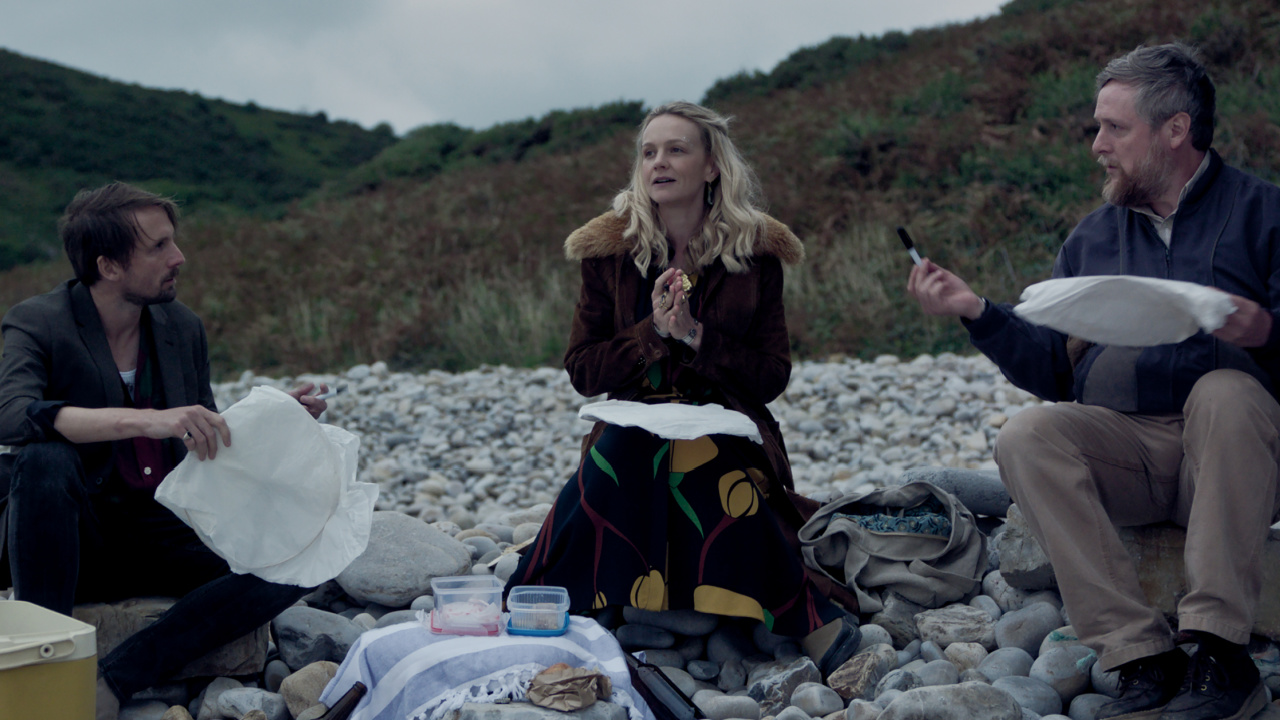 (L to R) Tom Basden as Herb McGwyer, Carey Mulligan as Nell Mortimer and Tim Key as Charles in director James Griffiths' 'The Ballad of Wallis Island', a Focus Features release. Photo Credit: Courtesy of Focus Features. © 2025 All Rights Reserved.