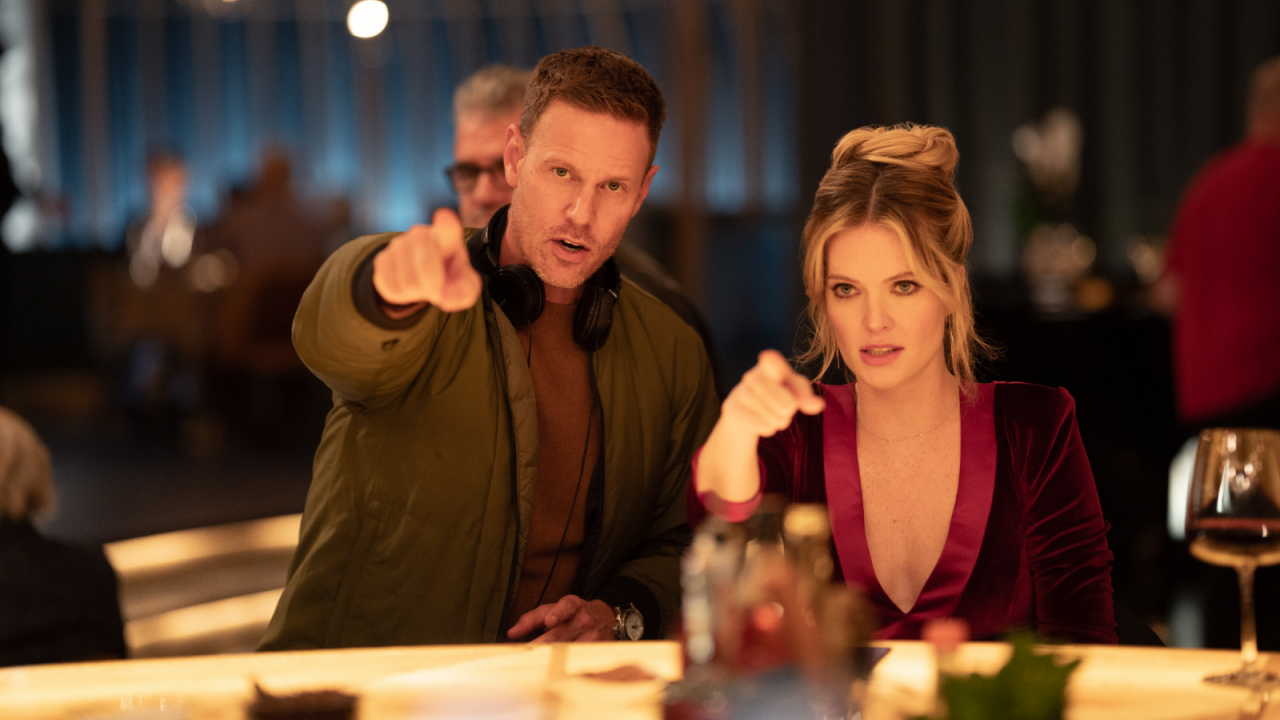 (from left) Director Christopher Landon and Meghann Fahy on the set of 'Drop'. Photo: Universal Pictures.