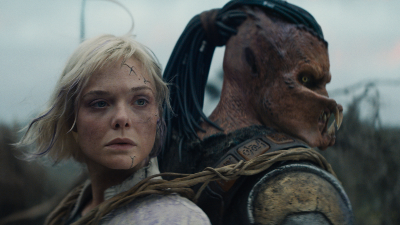 (L to R) Thia (Elle Fanning) and Dek (Dimitrius Schuster-Koloamatangi) in 20th Century Studios' 'Predator: Badlands' film. Photo courtesy of 20th Century Studios. © 2025 20th Century Studios. All Rights Reserved.