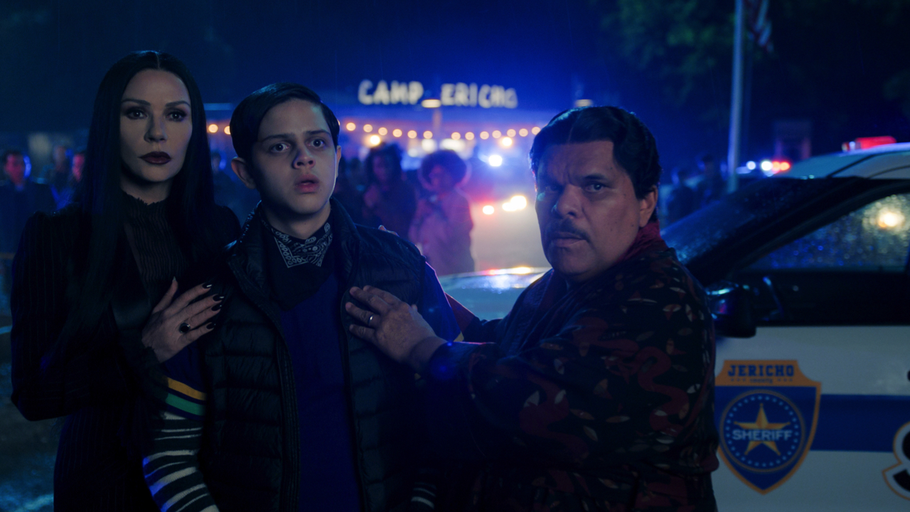 (L to R) Catherine Zeta-Jones as Morticia Addams, Isaac Ordonez as Pugsley Addams, Luis Guzmán as Gomez Addams in episode 203 of ‘Wednesday’ Season 2. Photo: Courtesy of Netflix © 2025.