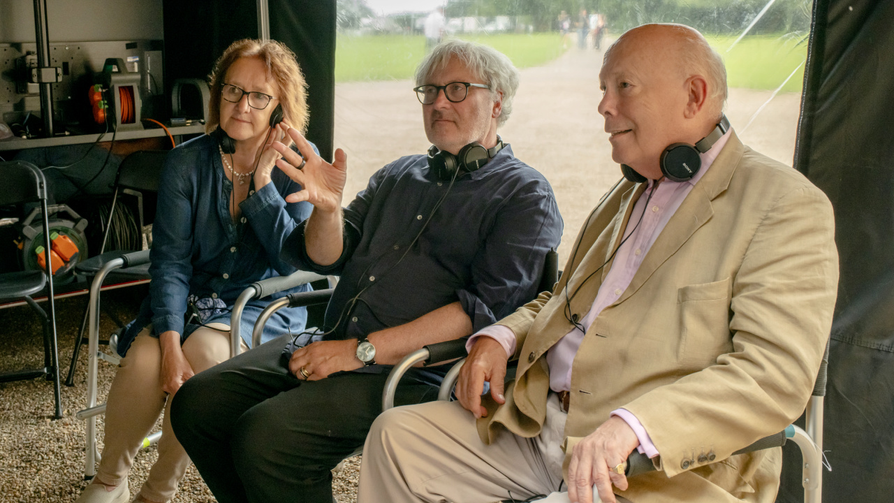 (L to R) Producer Liz Trubridge, director Simon Curtis and writer/creator/producer Julian Fellowes on the set of 'Downton Abbey: The Grand Finale', a Focus Features release. Credit: Rory Mulvey / © 2025 Focus Features LLC.