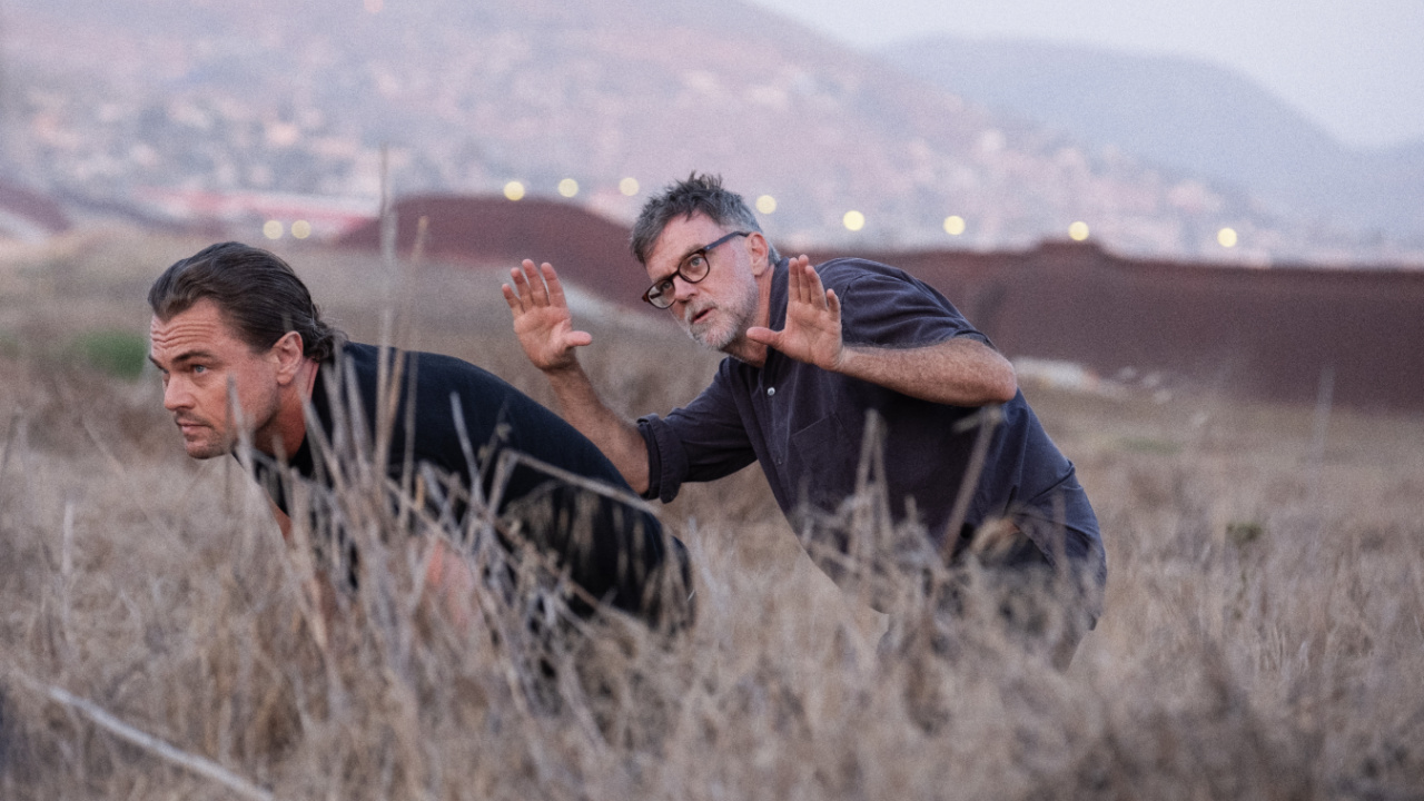 (L to R) Leonardo Di Caprio and Director/Writer/Producer Paul Thomas Anderson on the set of 'One Battle After Another.' A Warner Bros. Pictures Release. Photo Credit: Merrick Morton.