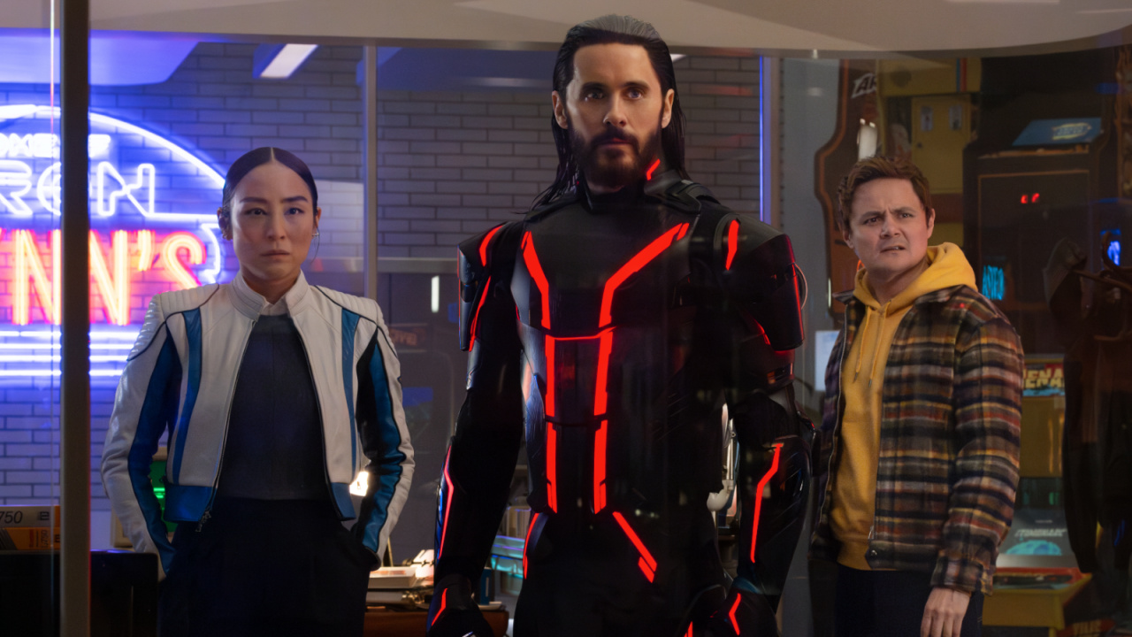 (L to R) Greta Lee as Eve Kim, Jared Leto as Ares, and Arturo Castro as Seth Flores in Disney's Live Action 'Tron: Ares'. Photo by Leah Gallo. © 2025 Disney Enterprises, Inc. All Rights Reserved.