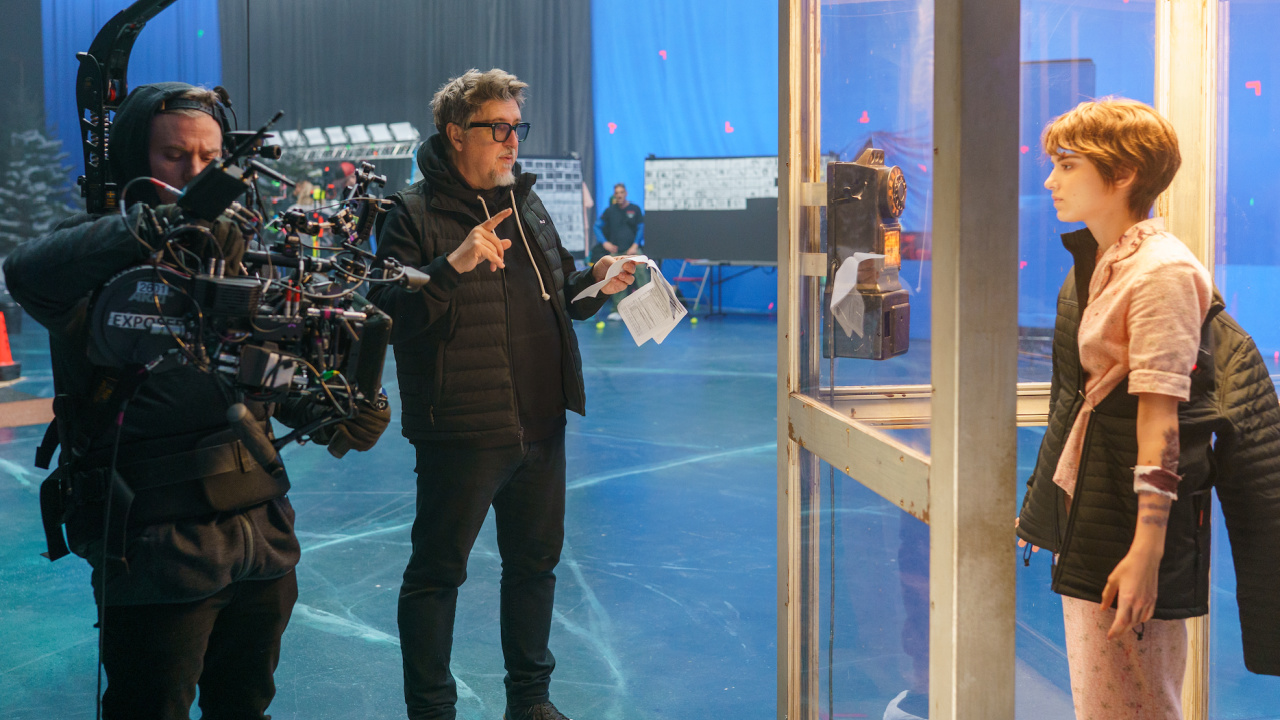 (L to R) Director Scott Derrickson and Madeleine McGraw on the set of 'Black Phone 2'. © 2025 Universal Studios. All Rights Reserved.