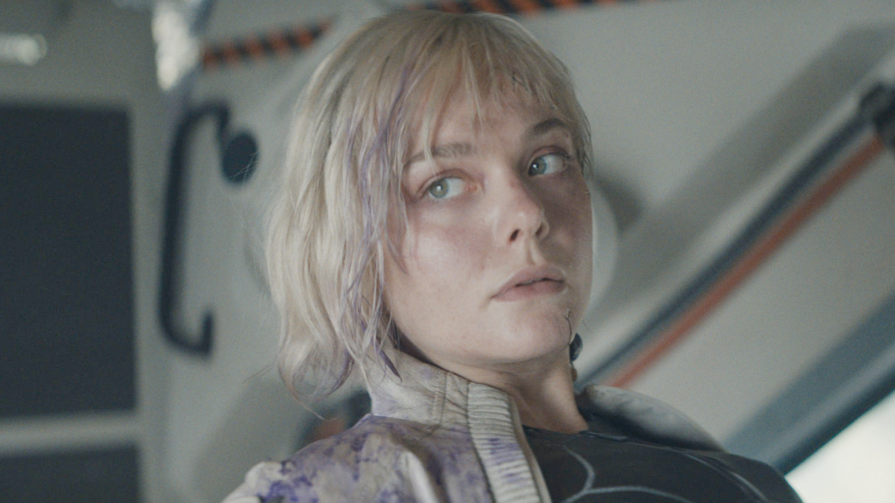 Thia (Elle Fanning) in 20th Century Studios' 'Predator: Badlands' film. Photo courtesy of 20th Century Studios. © 2025 20th Century Studios. All Rights Reserved.