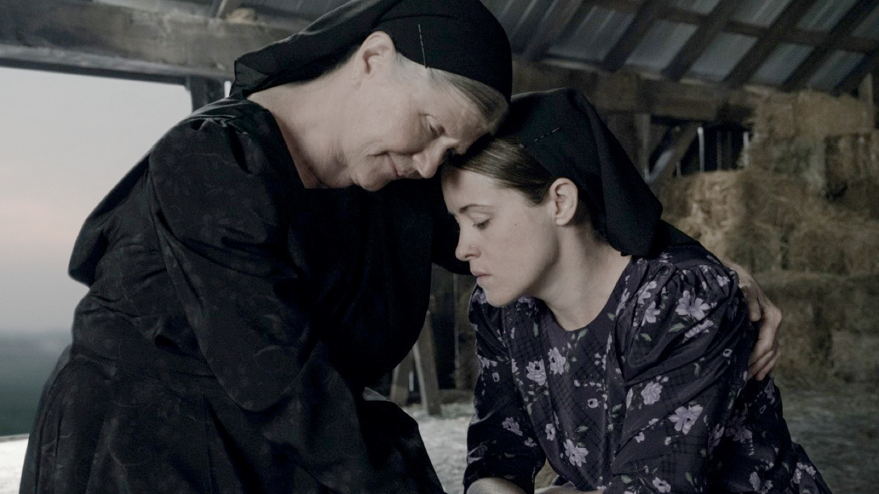 (L to R) Judith Ivey stars as Agata and Claire Foy as Salome in director Sarah Polley’s film 'Women Talking,' an Orion Pictures Release. Photo credit: Michael Gibson. © 2022 Orion Releasing LLC. All Rights Reserved.