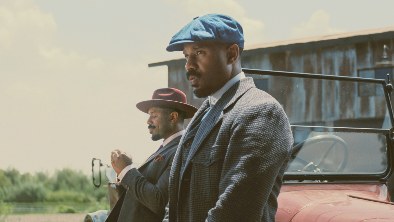 Michael B. Jordan as Smoke and Stack in Warner Bros. Pictures’ 'Sinners,' a Warner Bros. Pictures release. Photo Credit: Courtesy of Warner Bros. Pictures. Copyright: © 2025 Warner Bros. Entertainment Inc. All Rights Reserved.