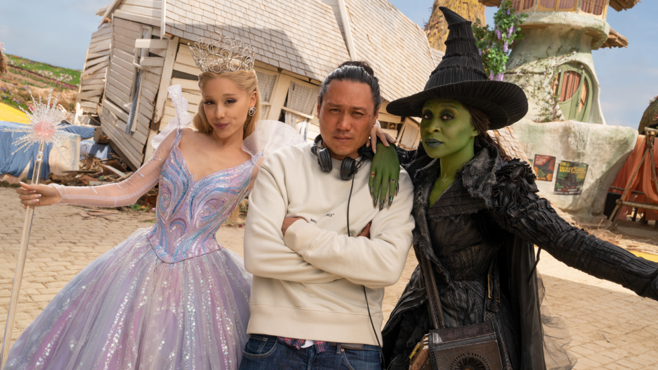(L to R) Ariana Grande (as Glinda), Director Jon M. Chu, and Cynthia Erivo (as Elphaba), on the set of 'Wicked For Good', directed by Jon M. Chu.