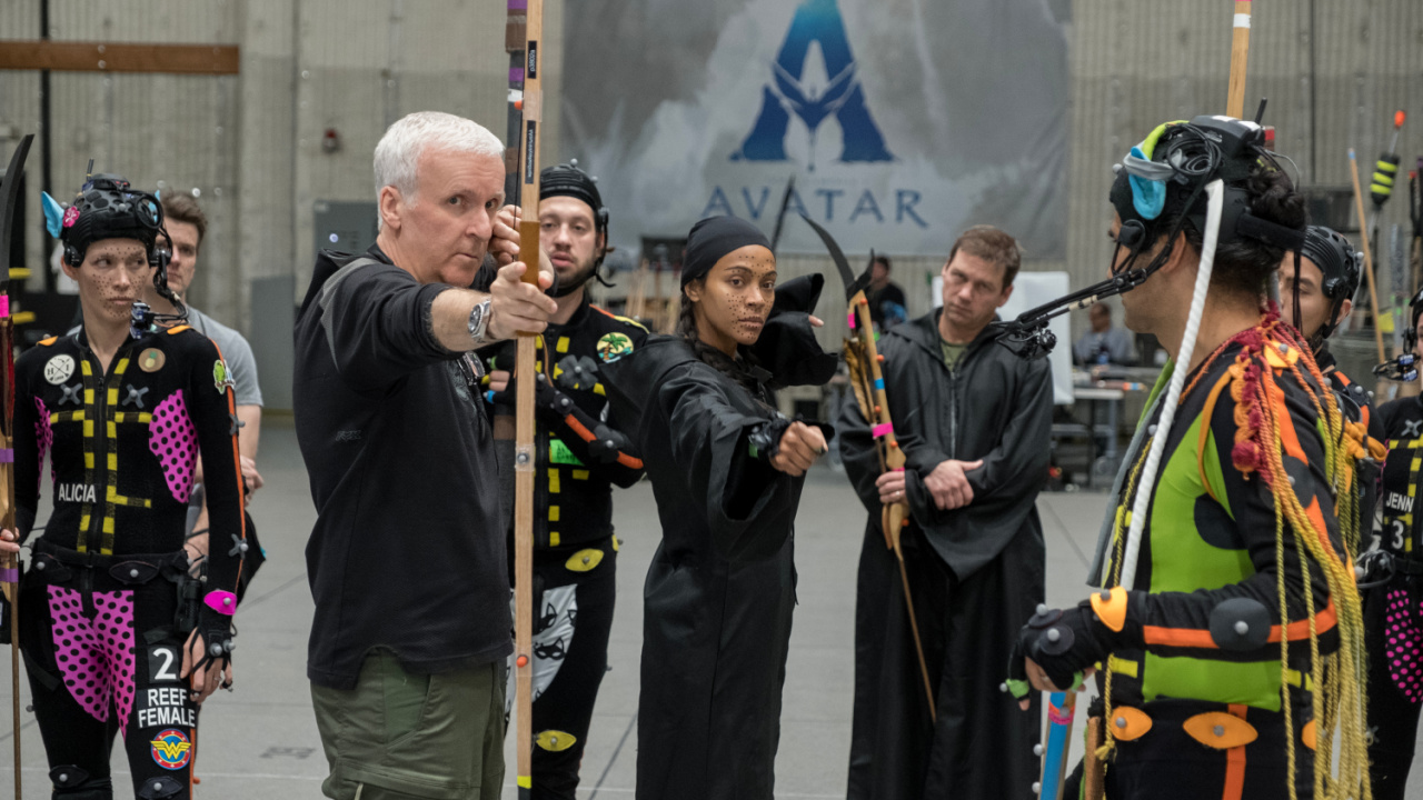 (L to R) Director James Cameron and Zoe Saldana on the set of 20th Century Studios' 'Avatar: Fire and Ash'. Photo by Mark Fellman. © 2024 20th Century Studios. All Rights Reserved.