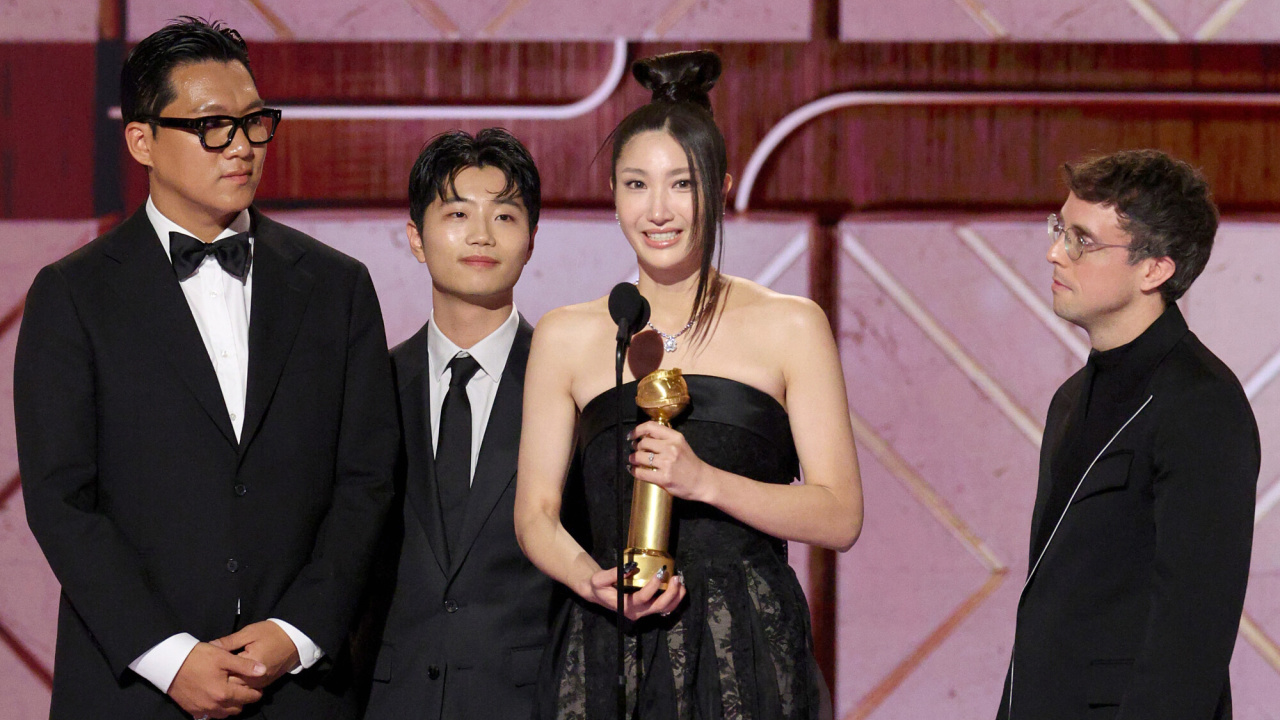 EJAE (2nd from R) accepts the Best Original Song - Motion Picture Award for "Golden" from KPop Demon Hunters onstage during the 83rd Annual Golden Globes®, airing live from the Beverly Hilton in Beverly Hills, California on Sunday, January 11, 2026 at 8 PM ET/5 PM PT, on CBS and streaming on Paramount+. Photo: Kevork Djansezian/CBS ©2026 CBS Broadcasting, Inc. All Rights Reserved.