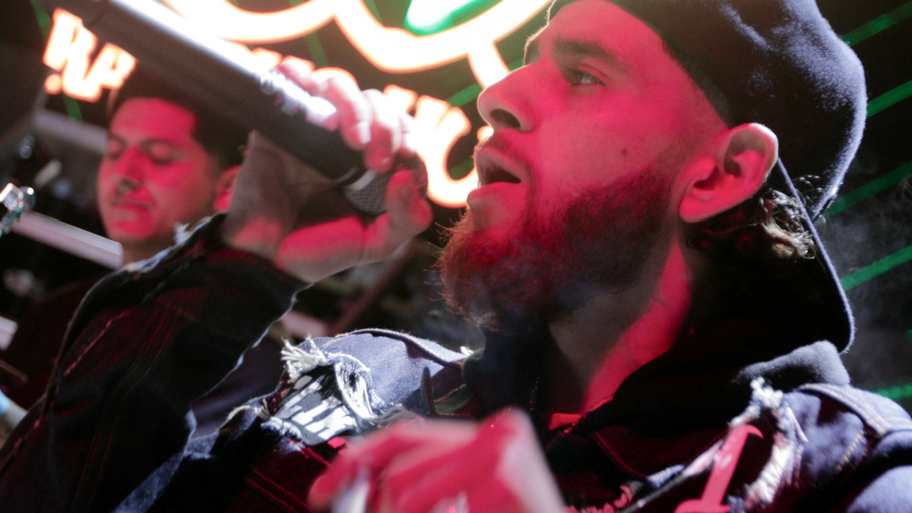 Chito (Jay Dee) performing on stage in 'Clika'. Photo: Sony Pictures. © 2025 CTMG, Inc. All Rights Reserved.