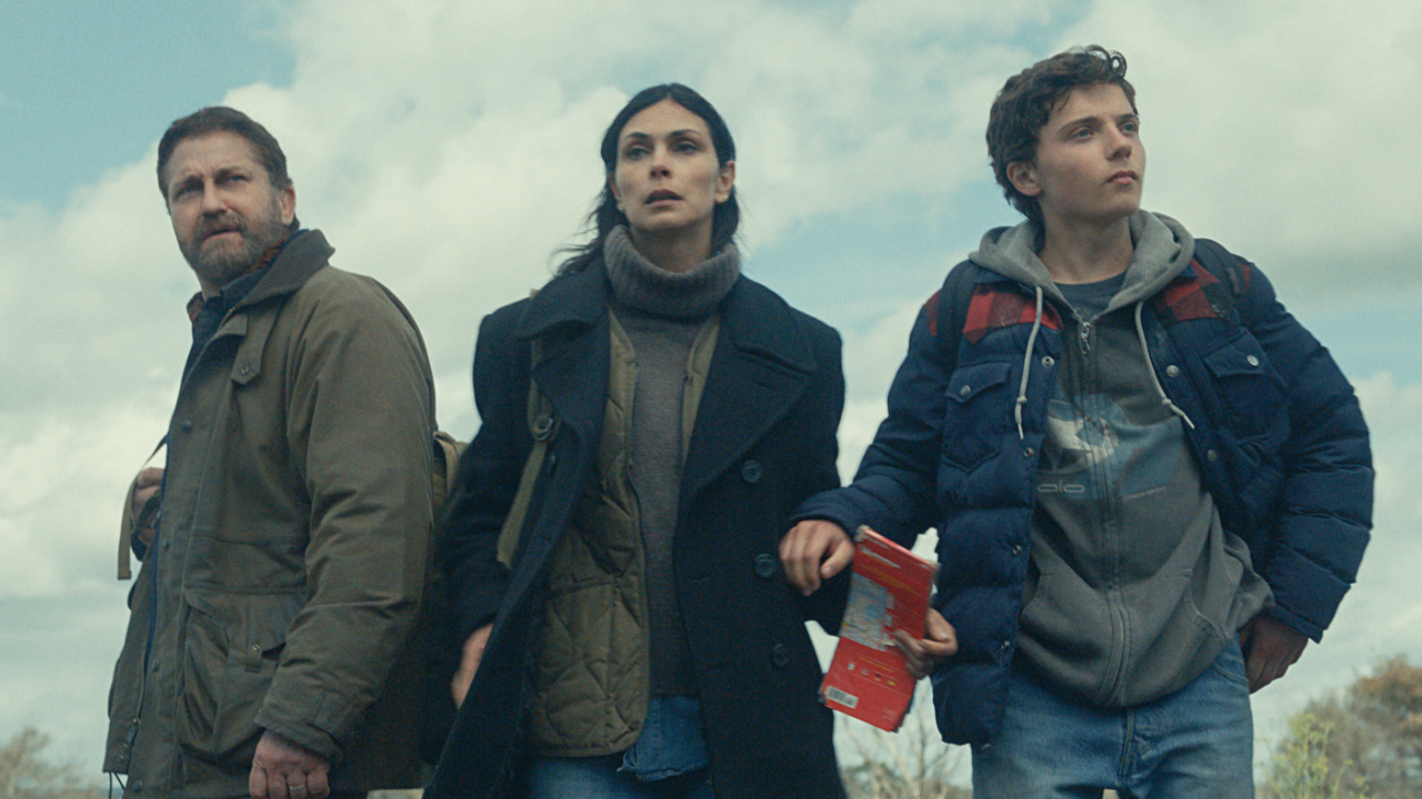 (L to R) Gerard Butler as John Garrity, Morena Baccarin as Allison Garrity, and Roman Griffin Davis as Nathan Garrity in 'Greenland 2: Migration'. Photo Credit: Courtesy of Lionsgate.