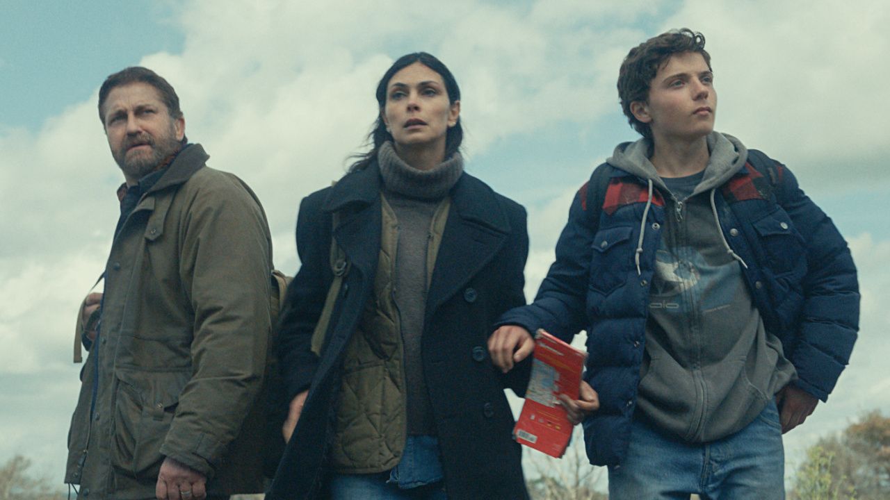 (L to R) Gerard Butler as John Garrity, Morena Baccarin as Allison Garrity, and Roman Griffin Davis as Nathan Garrity in 'Greenland 2: Migration'. Photo Credit: Courtesy of Lionsgate.